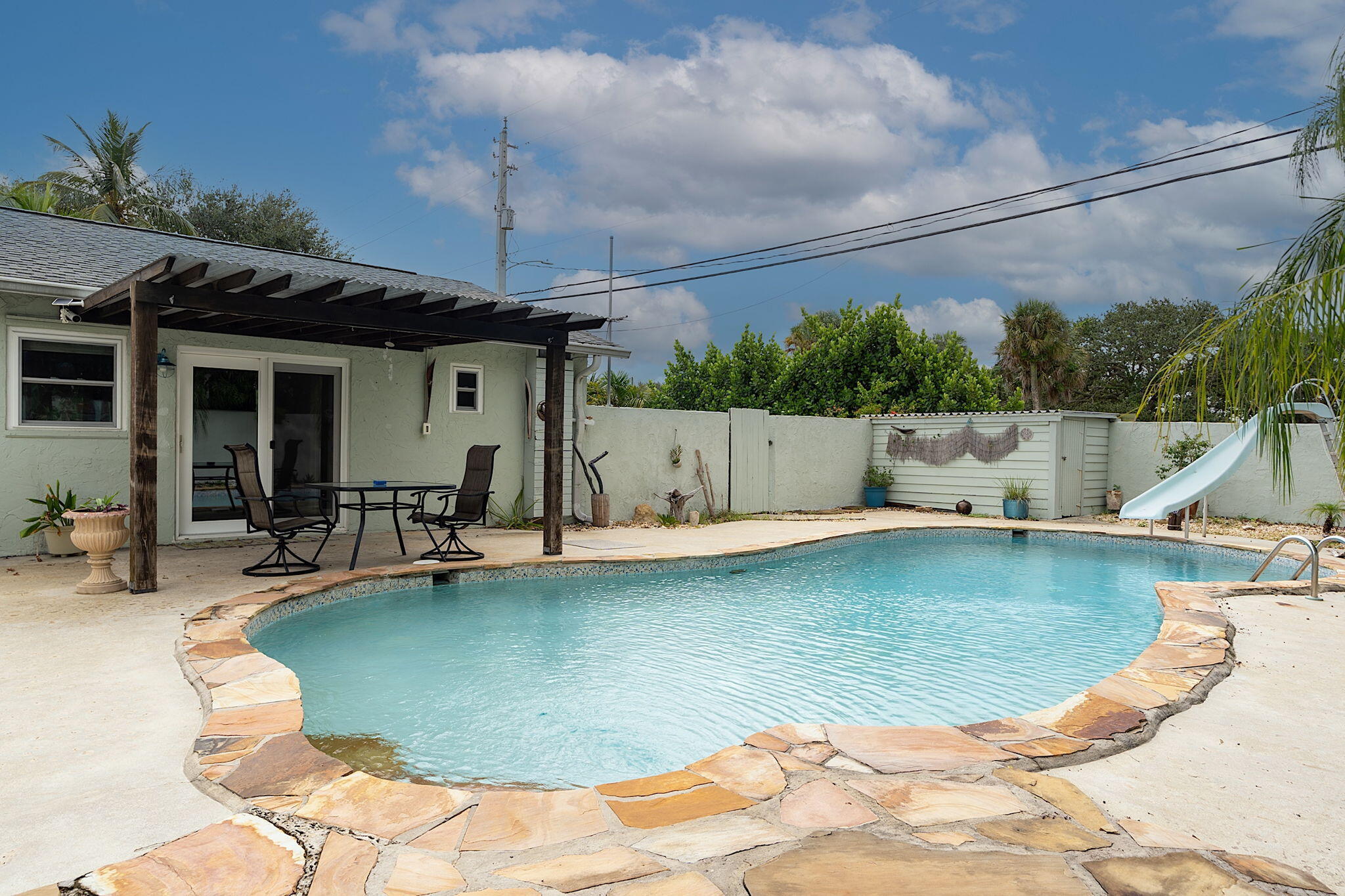 a view of a swimming pool with a lounge chairs