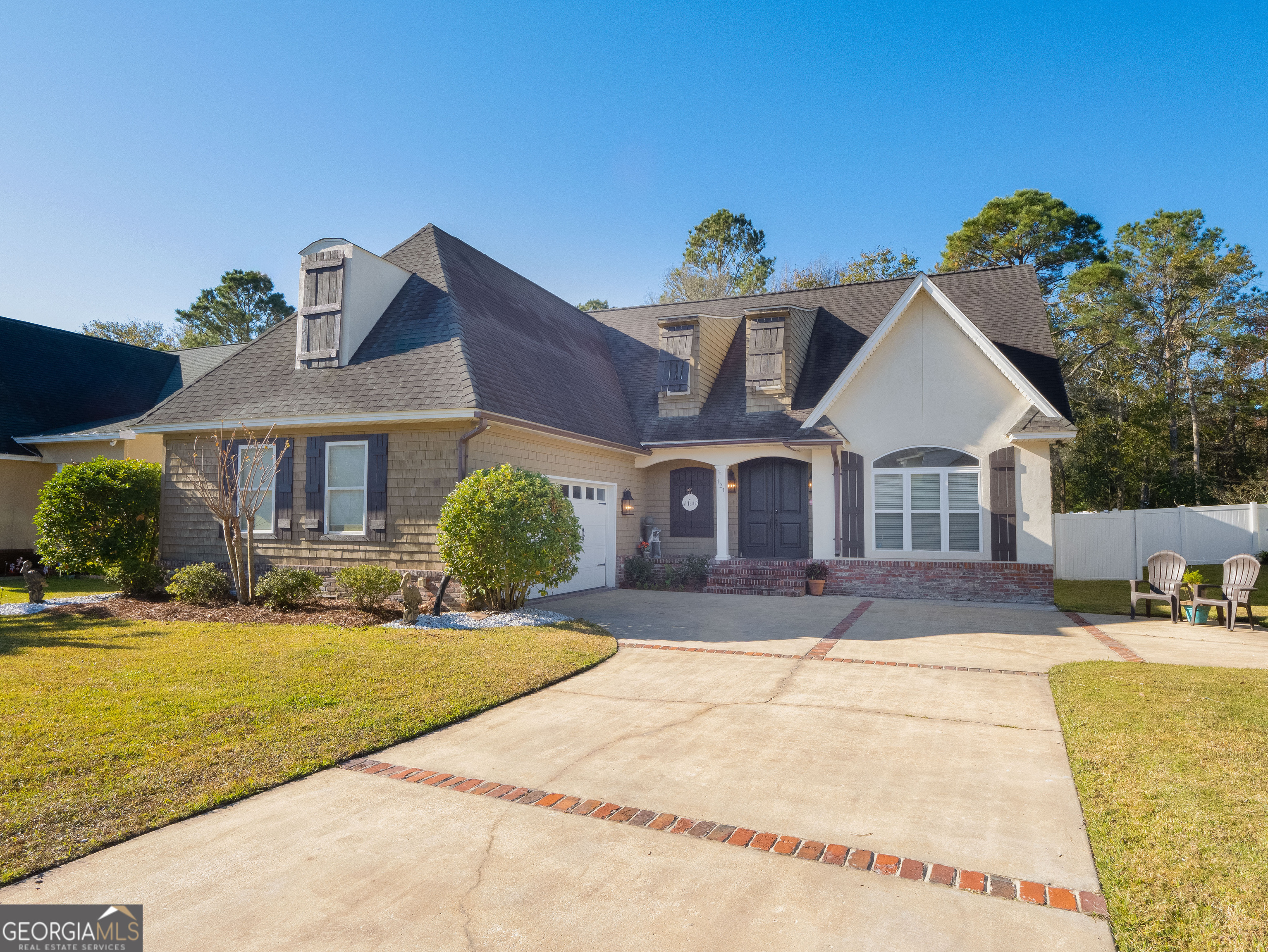 a front view of a house with a yard