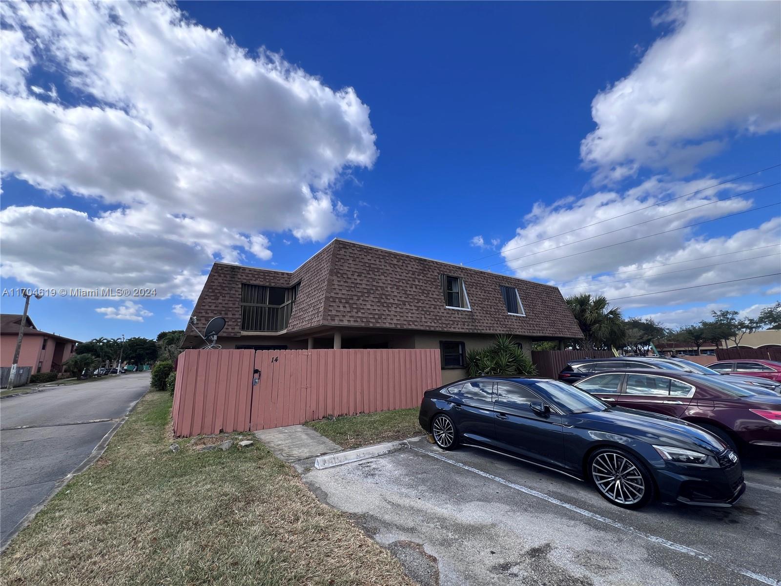 a car parked in front of a house