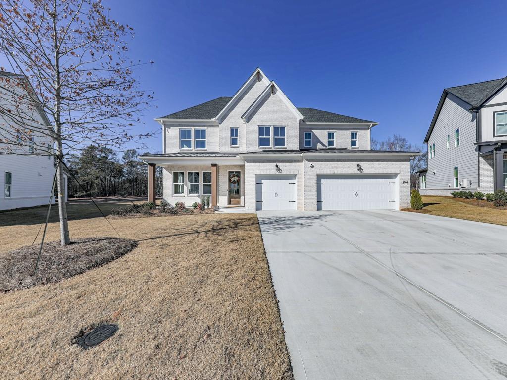 a view of a house with a yard