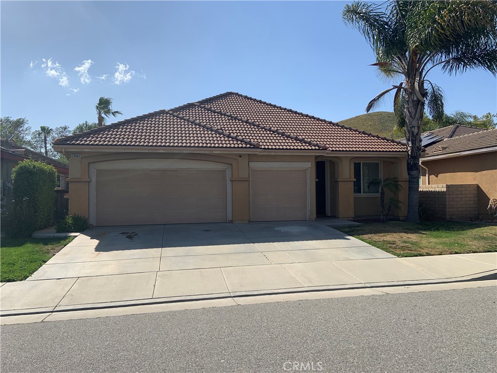 a front view of a house with garage