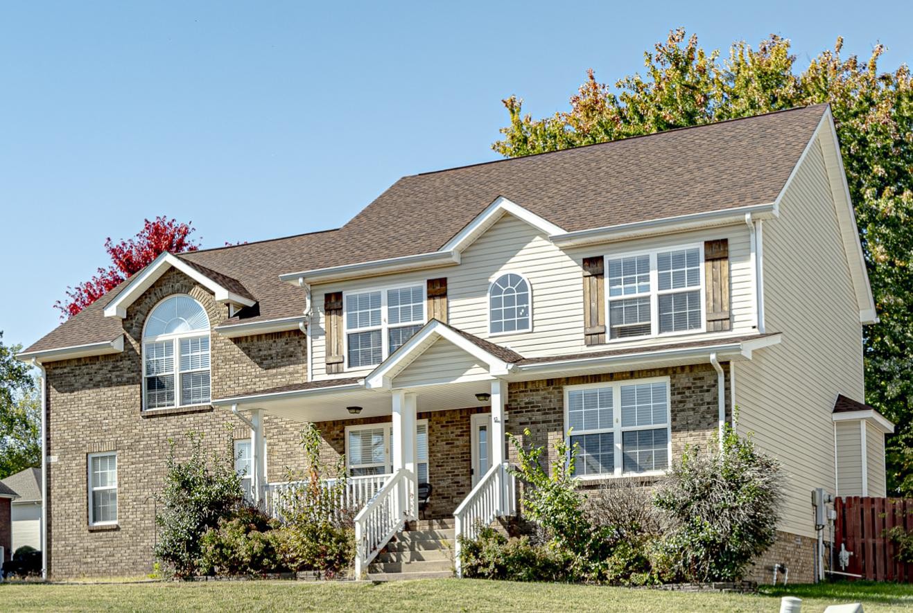 a front view of a house with a yard