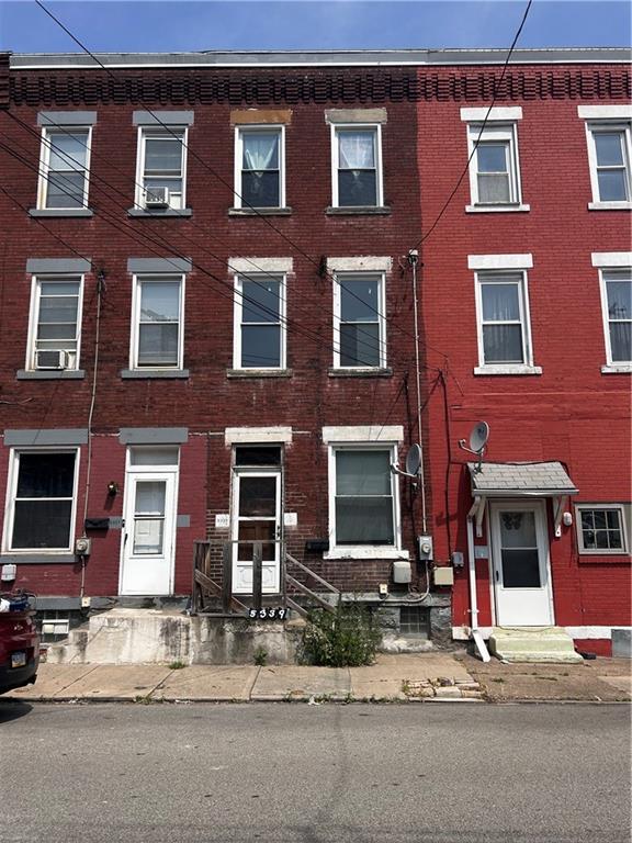 a red brick building that has lot of windows on it