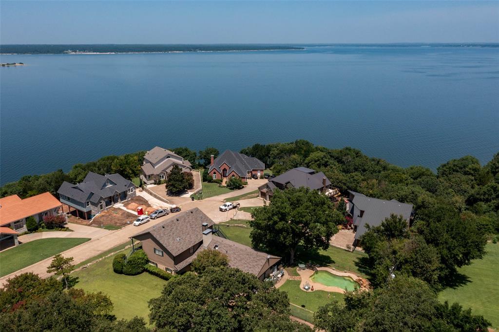 an aerial view of a house with yard and outdoor seating