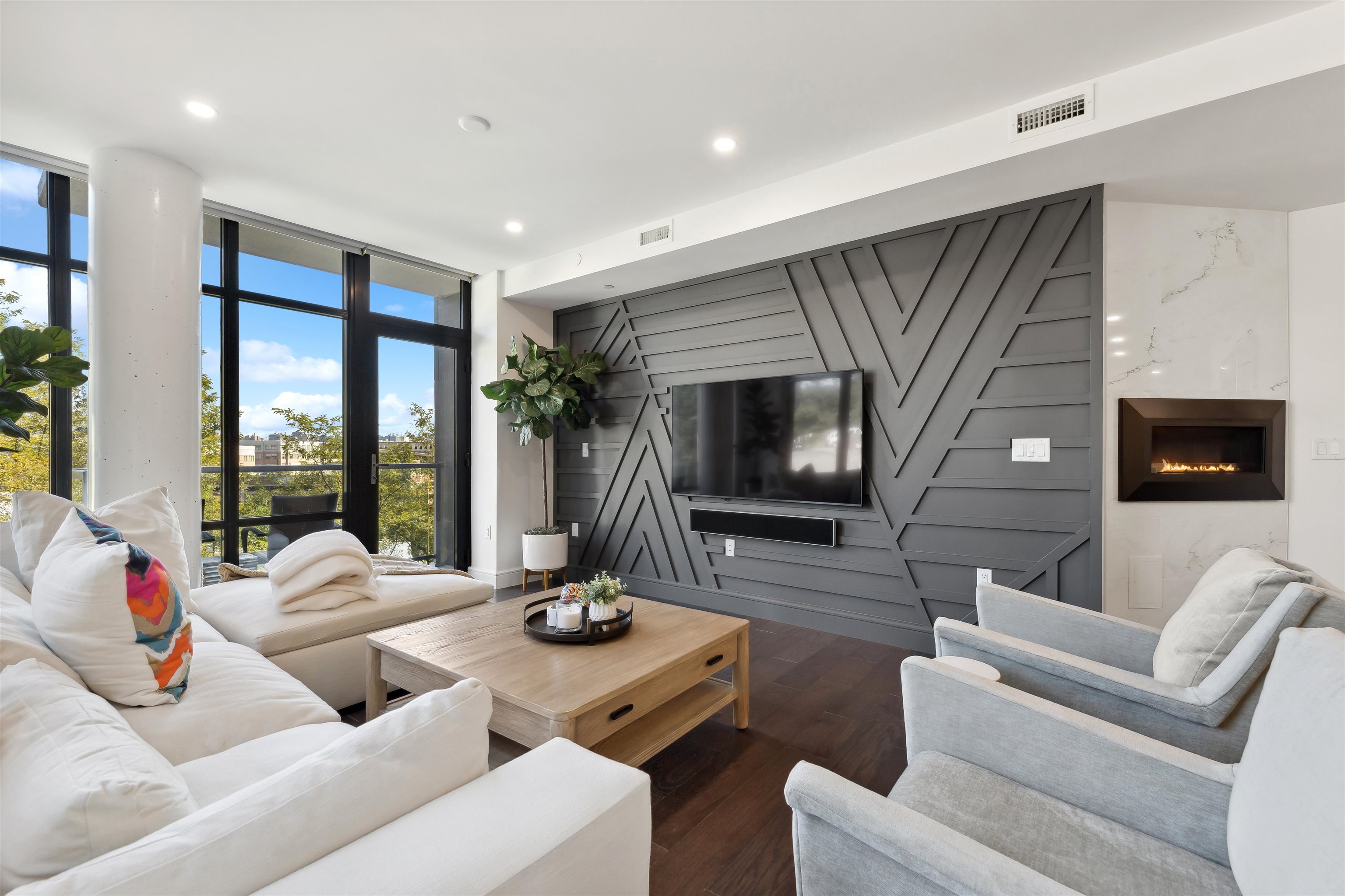 a living room with furniture and a flat screen tv