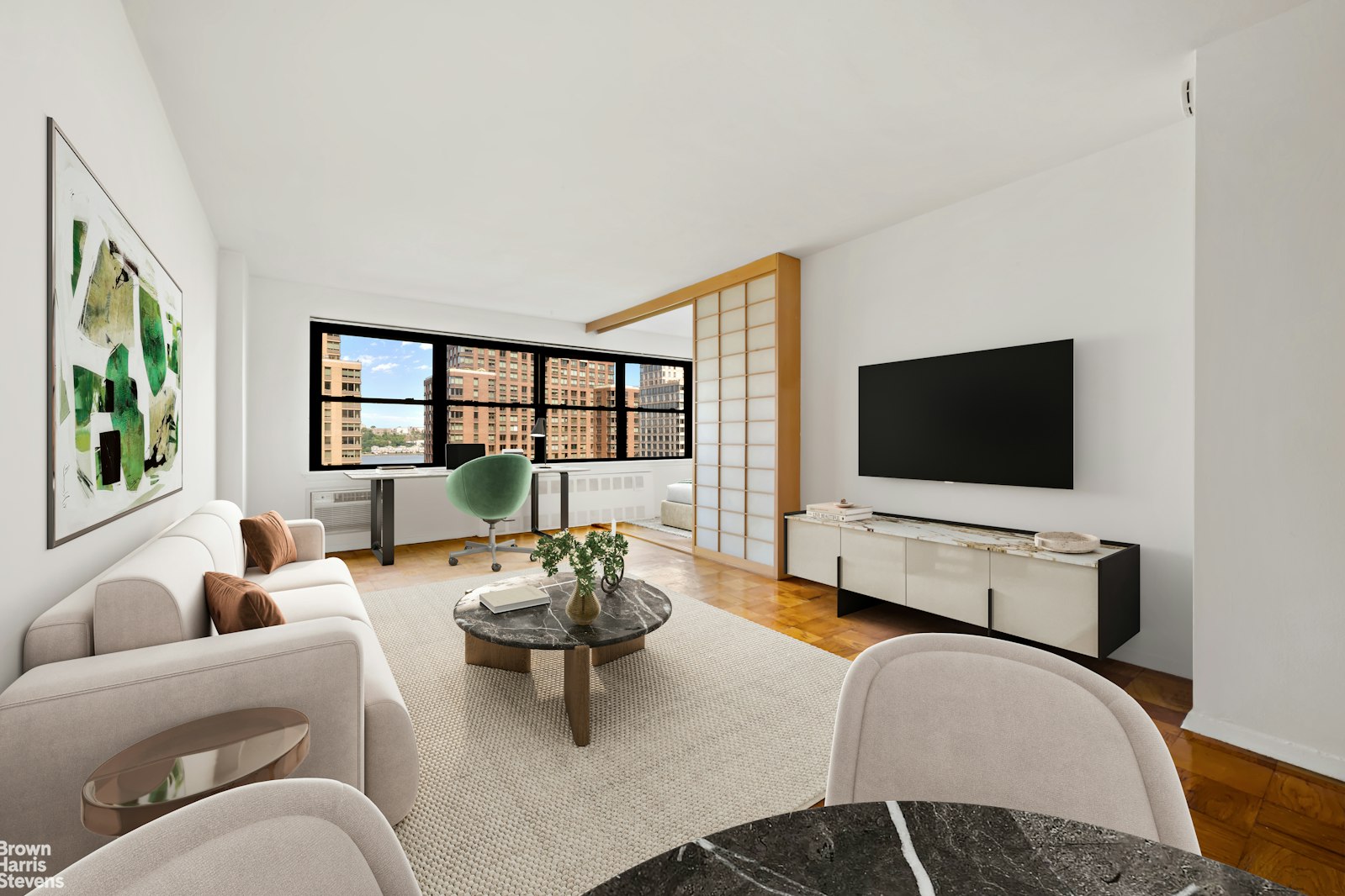 a living room with furniture and a flat screen tv