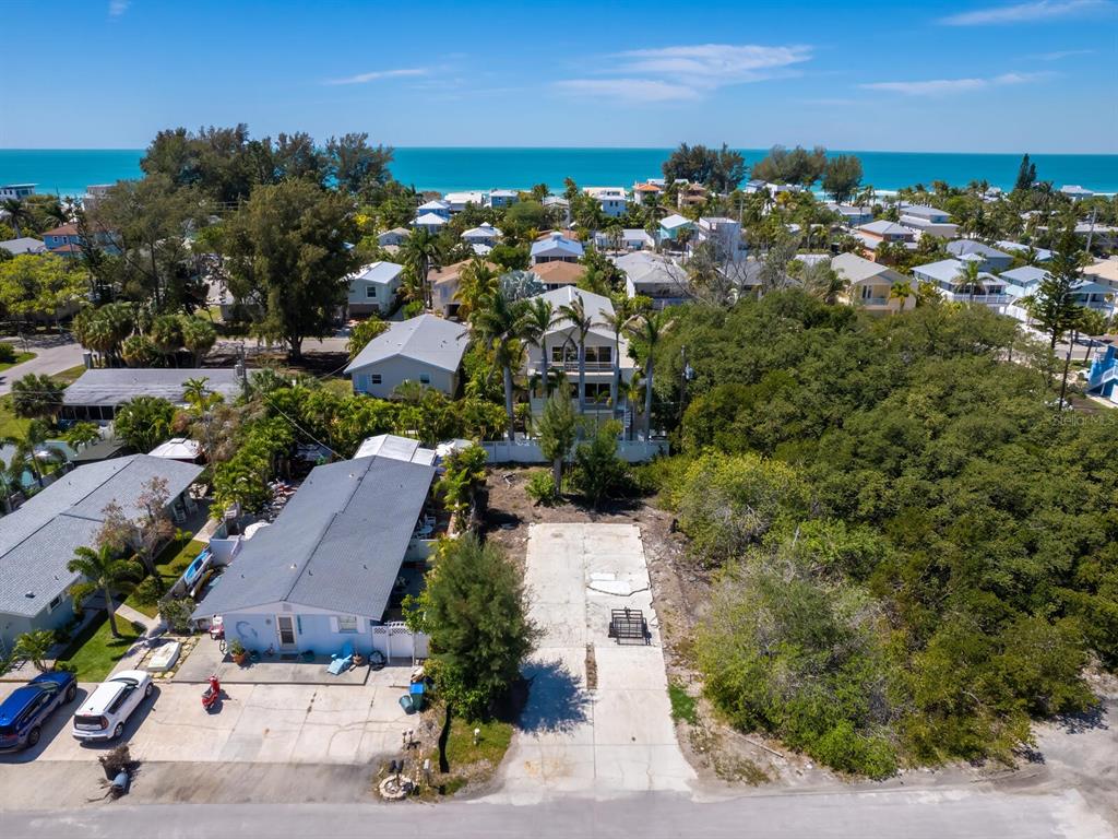 an aerial view of multiple houses with yard