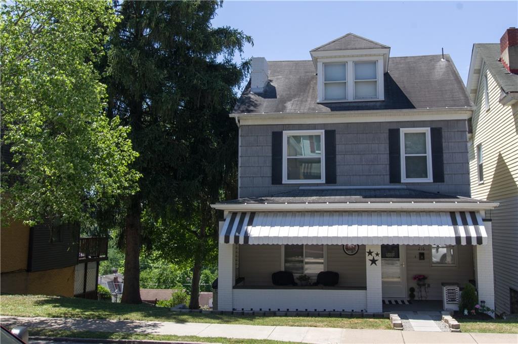 a front view of a building with garden