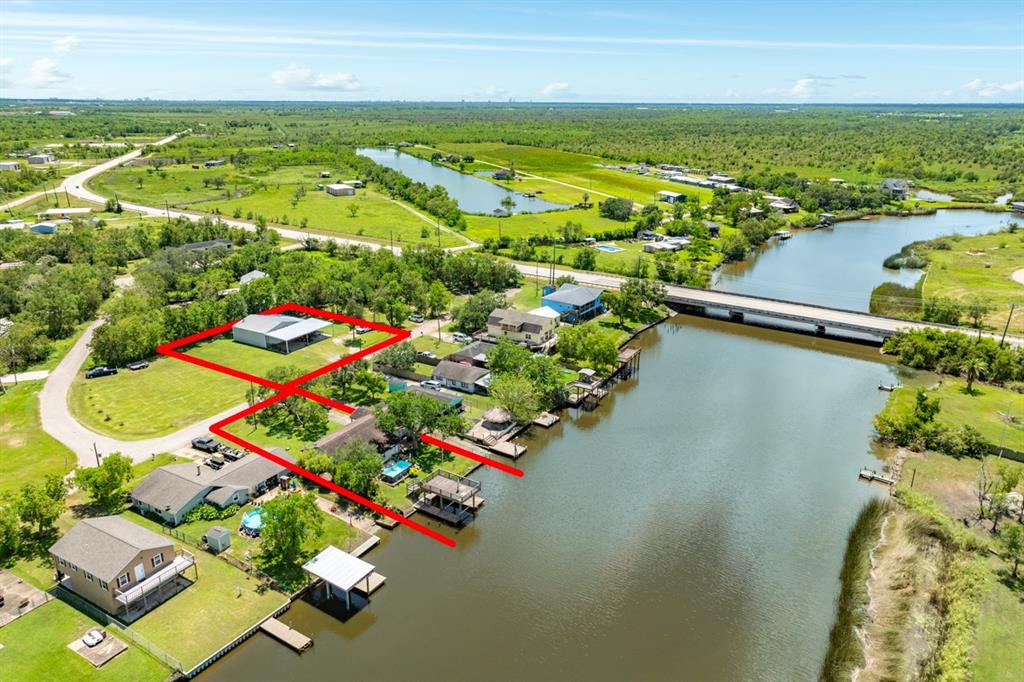 an aerial view of residential houses with outdoor space and swimming pool