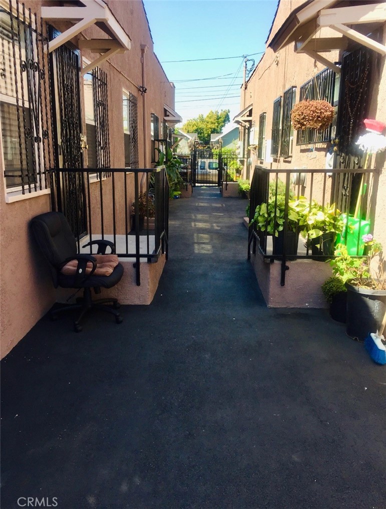 a view of a chairs and tables in the patio