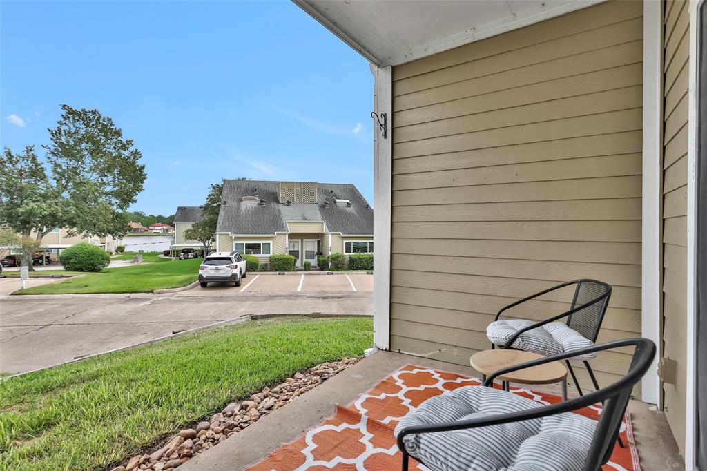 a view of a patio with a table and chairs