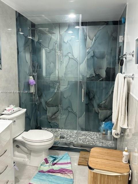 a bathroom with a toilet sink and shower