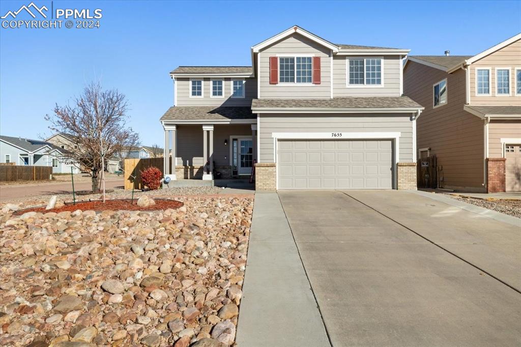 a front view of a house with yard