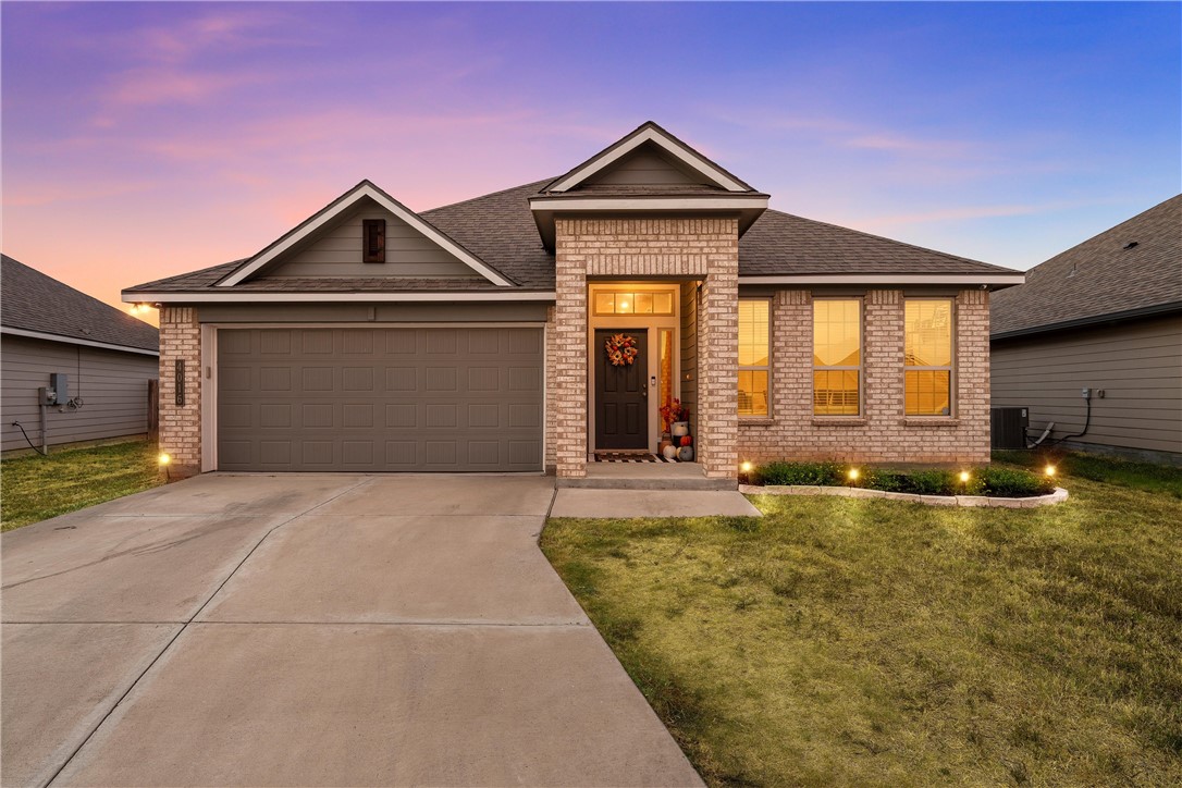 a front view of a house with yard