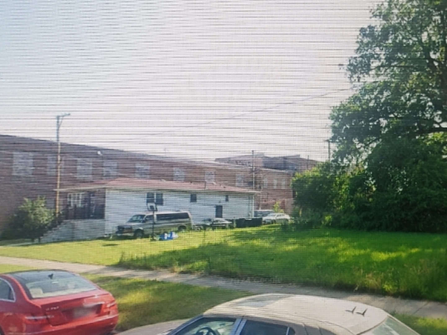 a view of a swimming pool with a yard