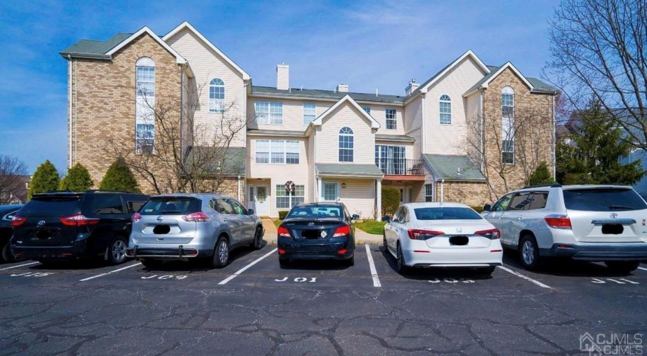 a view of a car parked in front of a house