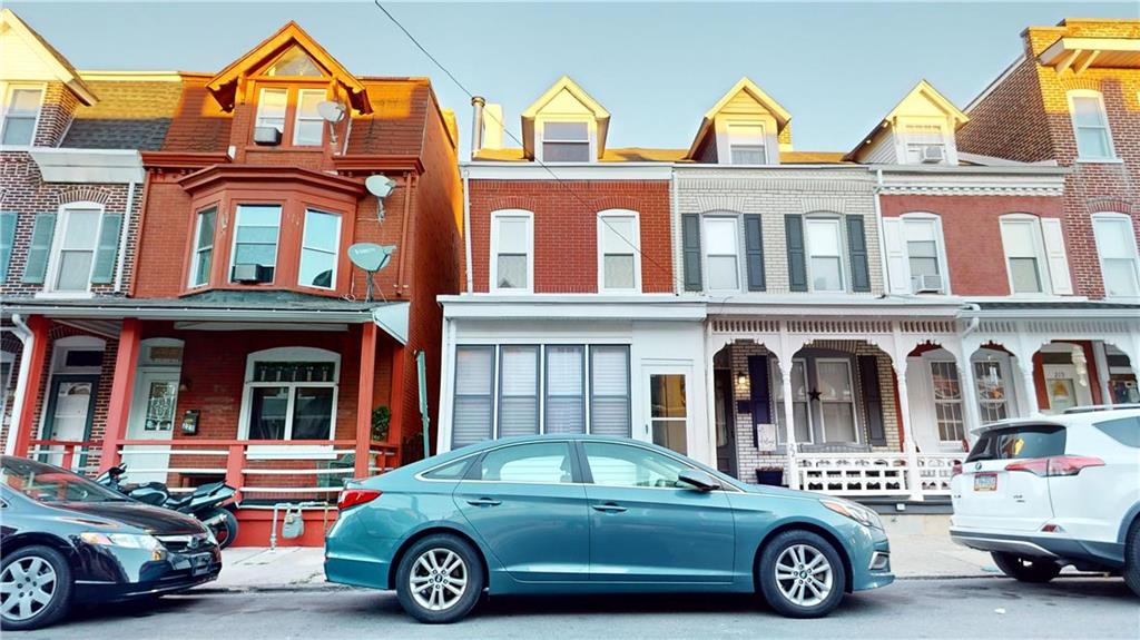 a car parked in front of a house