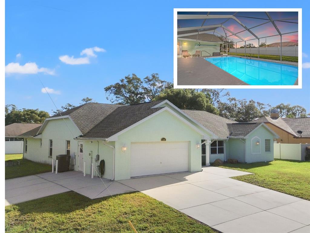 a view of house with backyard and outdoor seating