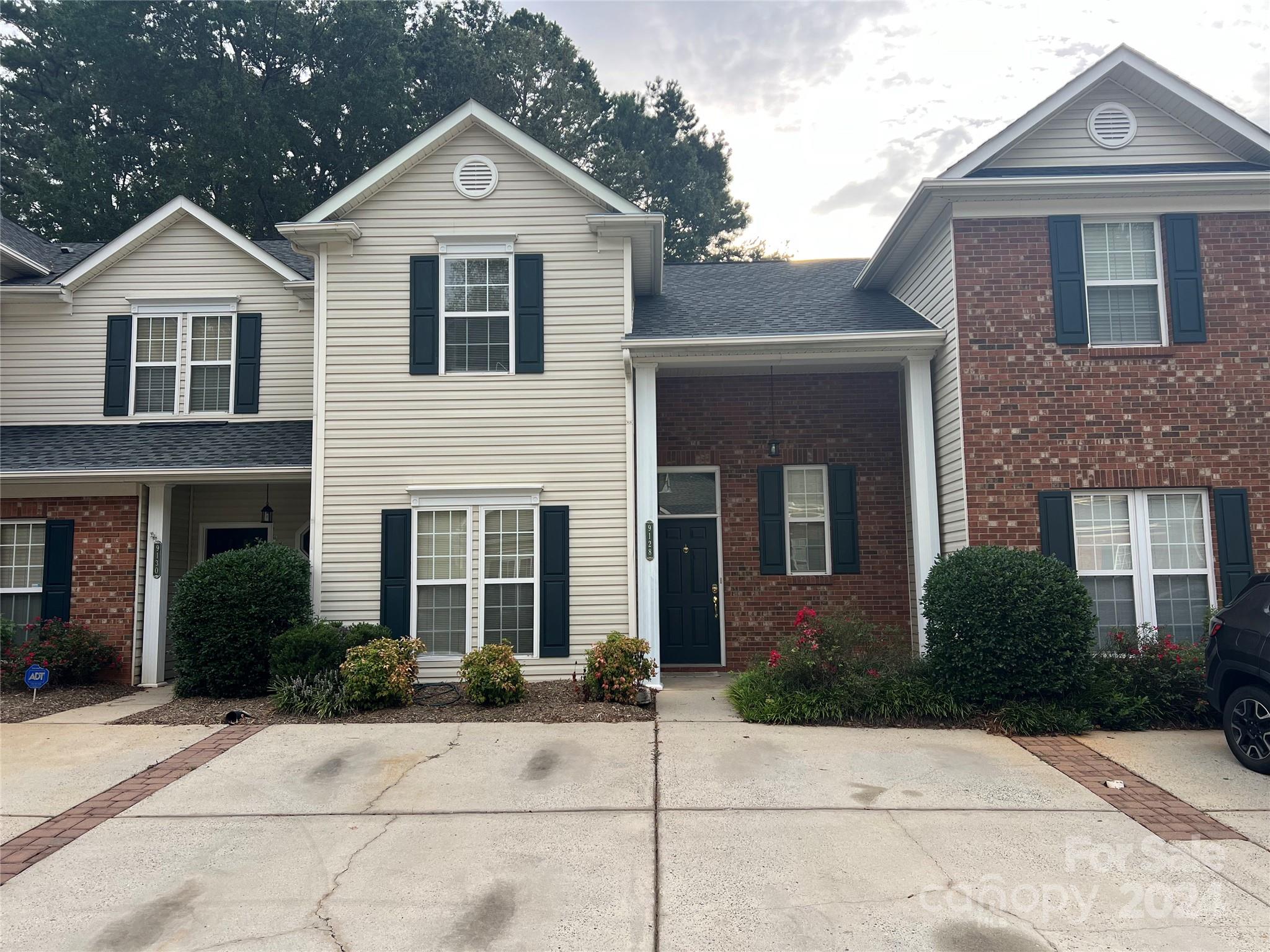 a front view of a house with yard