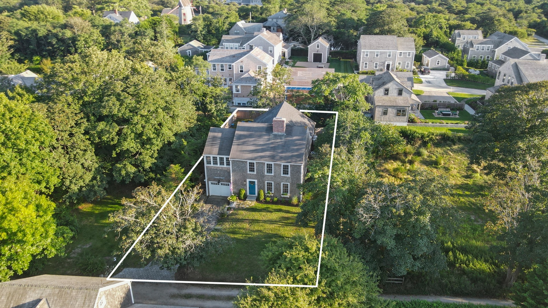 aerial view of a house with a yard