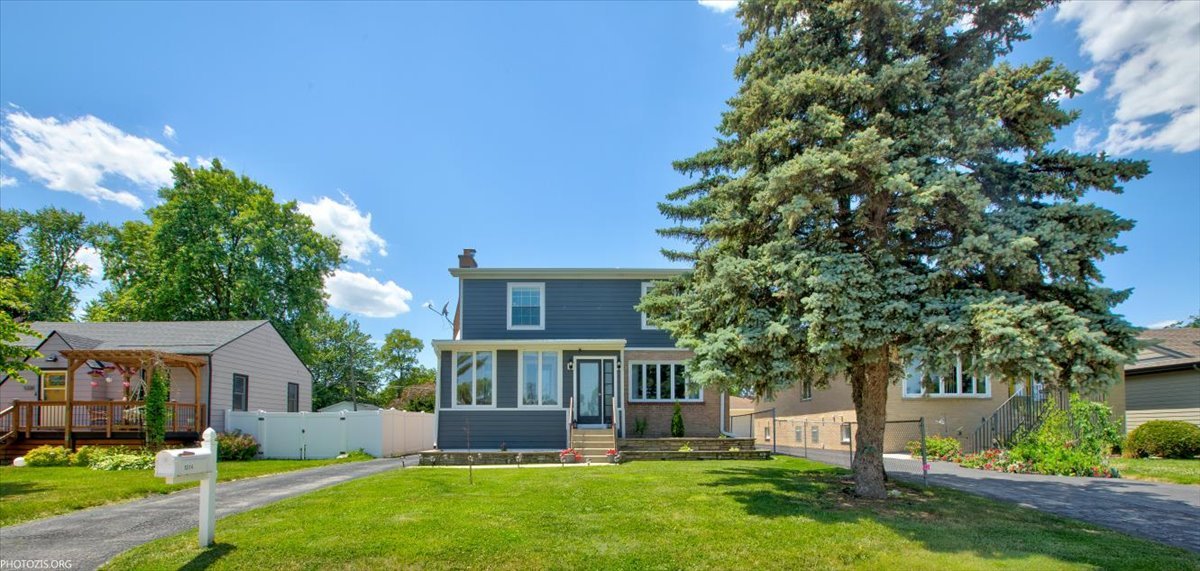 front view of a house with a yard