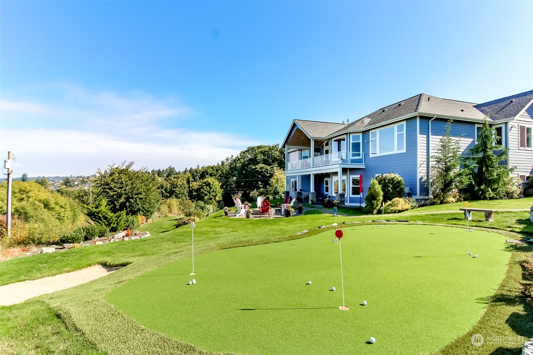 a front view of a house with a big yard