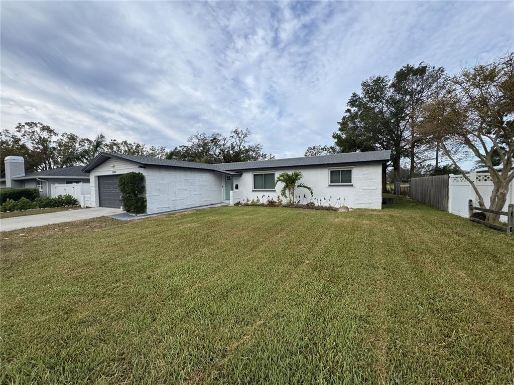 a front view of house with garden