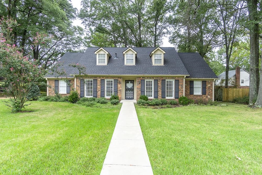 a front view of a house with yard