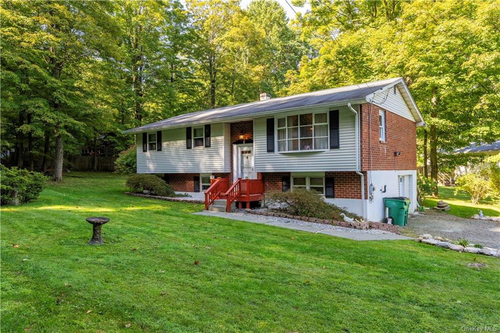 Bi-level home with a front yard