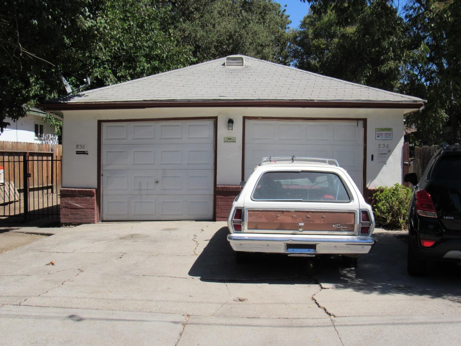 a front view of a house with a garage