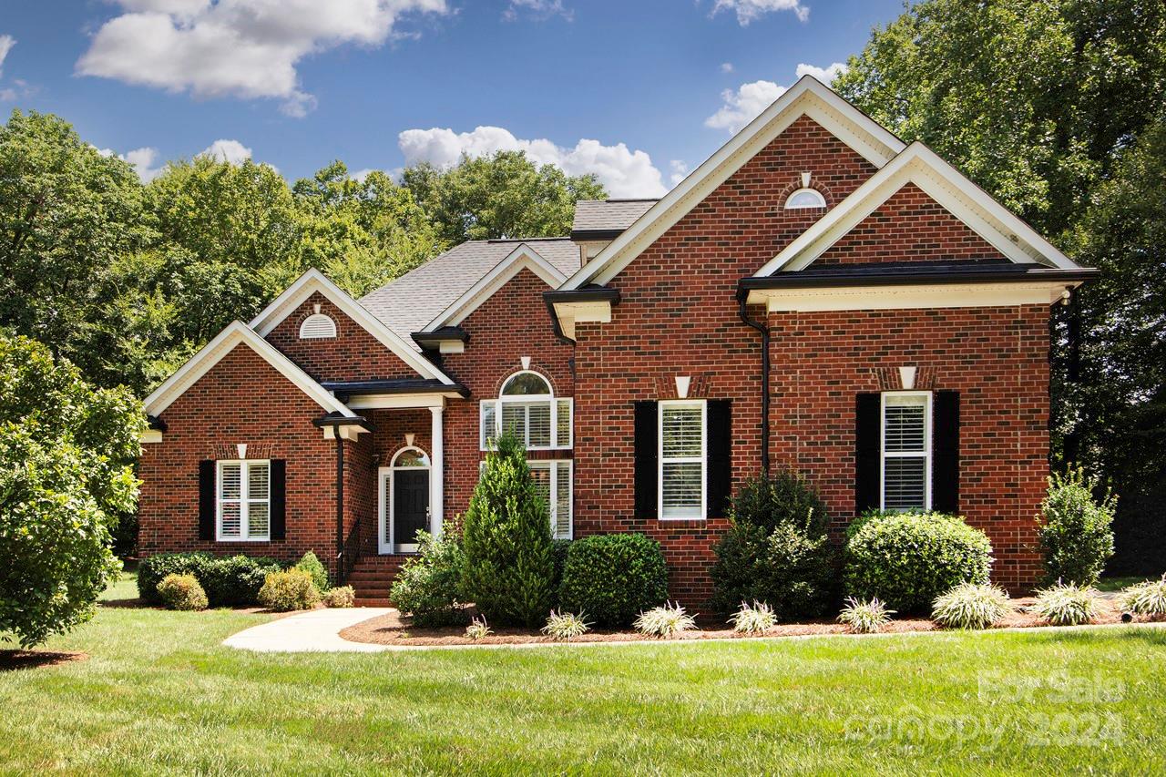 front view of a house with a yard