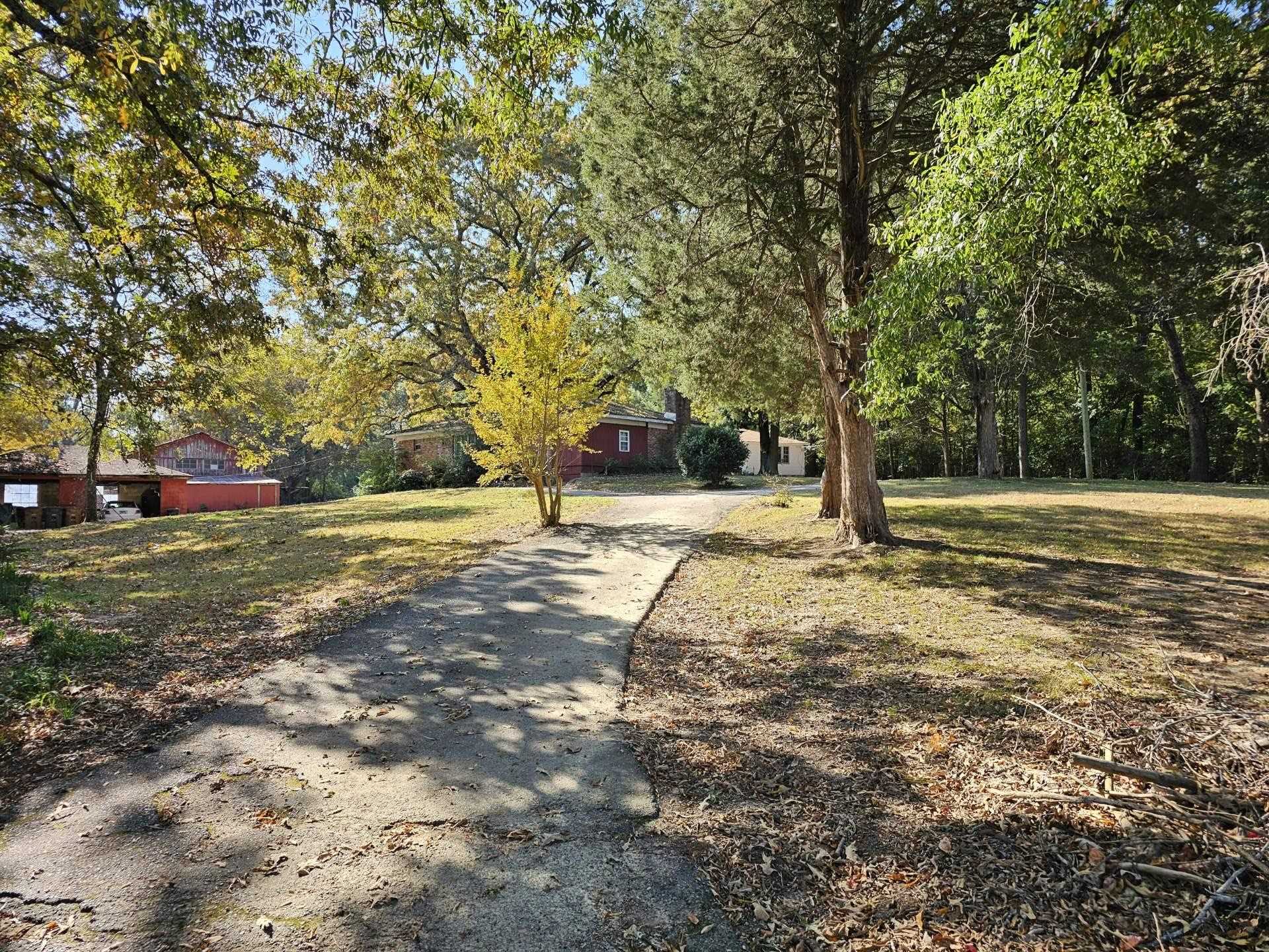 a backyard of a house with lots of green space