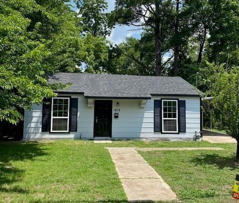 front view of a house with a yard