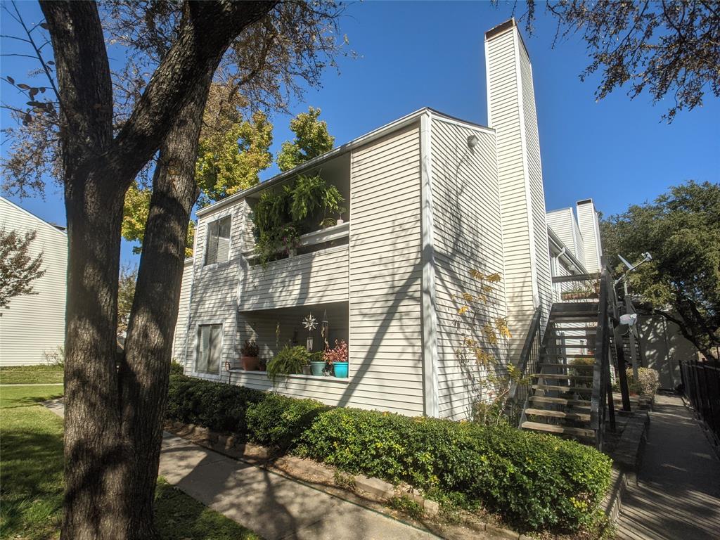 a view of a house with a tree