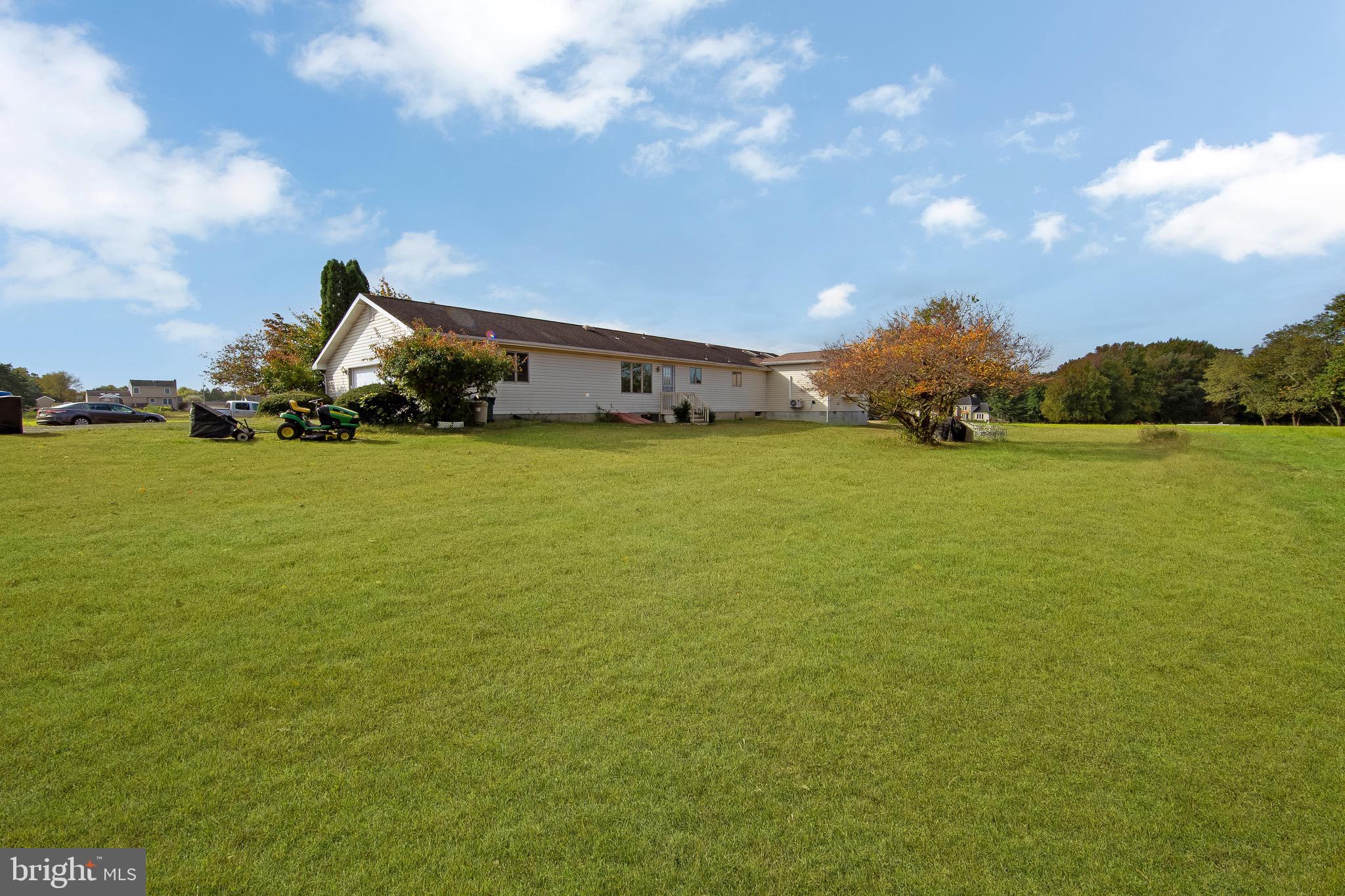 a view of a large building with garden in front of it