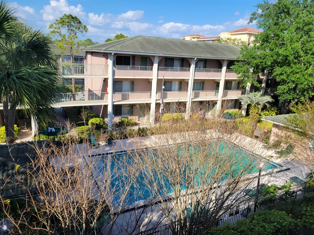 a view of swimming pool with outdoor seating