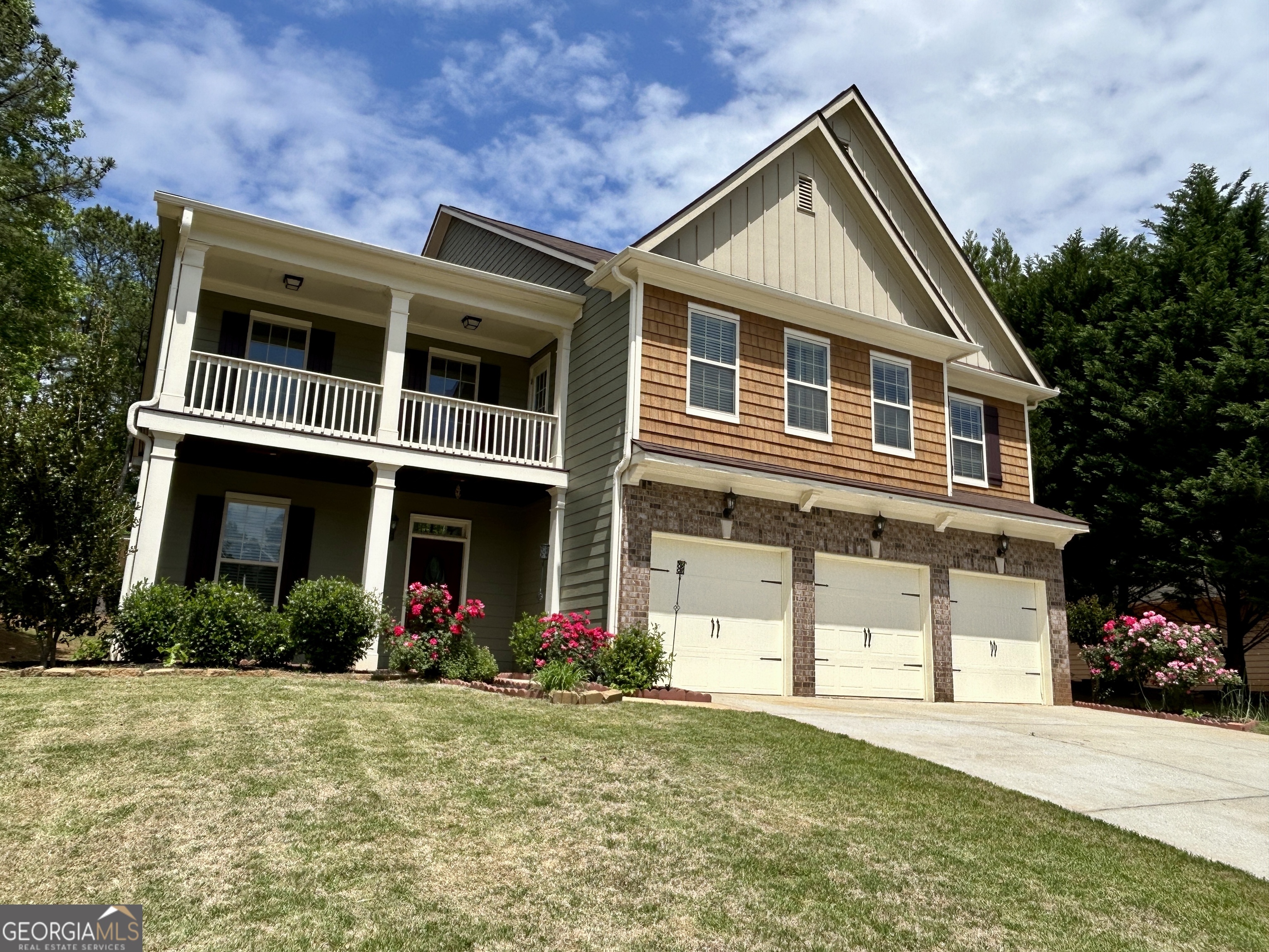 a front view of a house with a yard