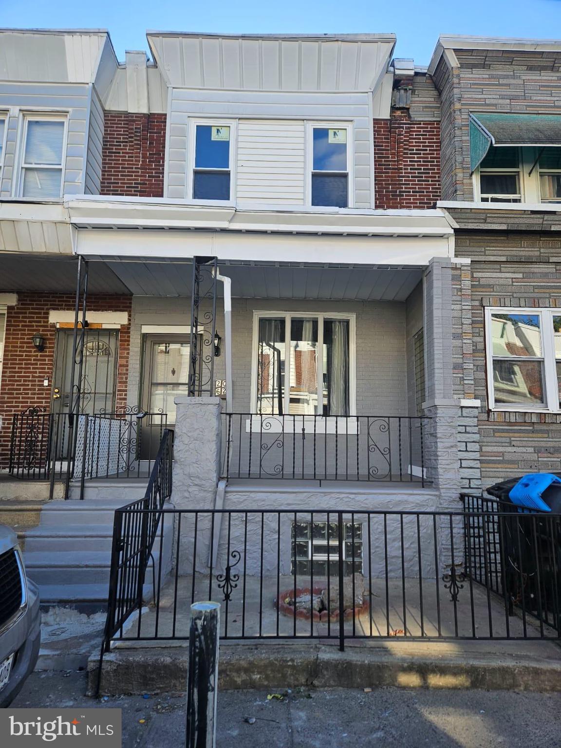 a front view of a house with a porch