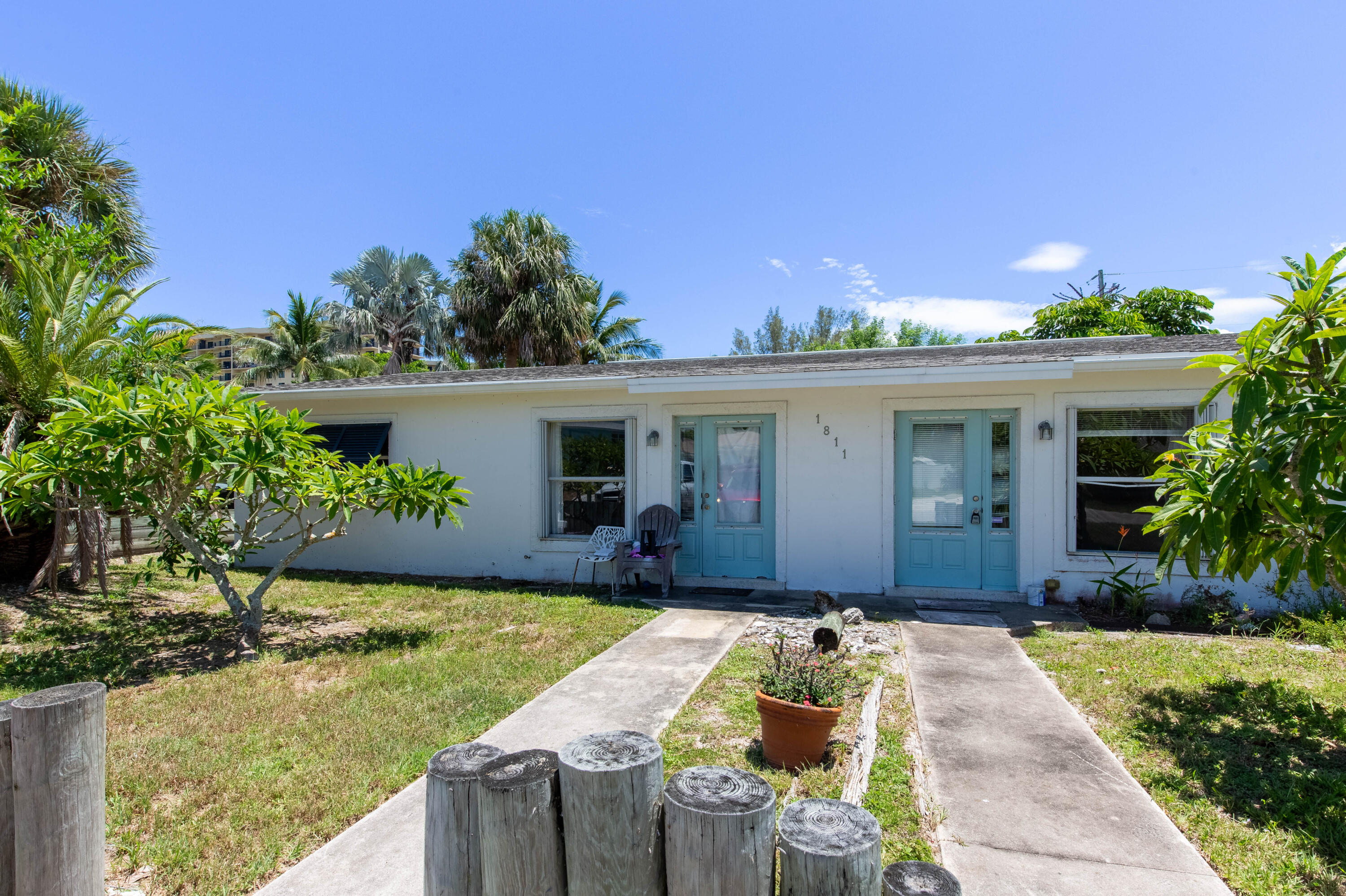 a front view of house with yard and outdoor seating