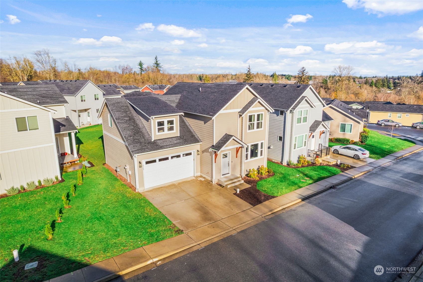 aerial view of a house with a yard and potted plants