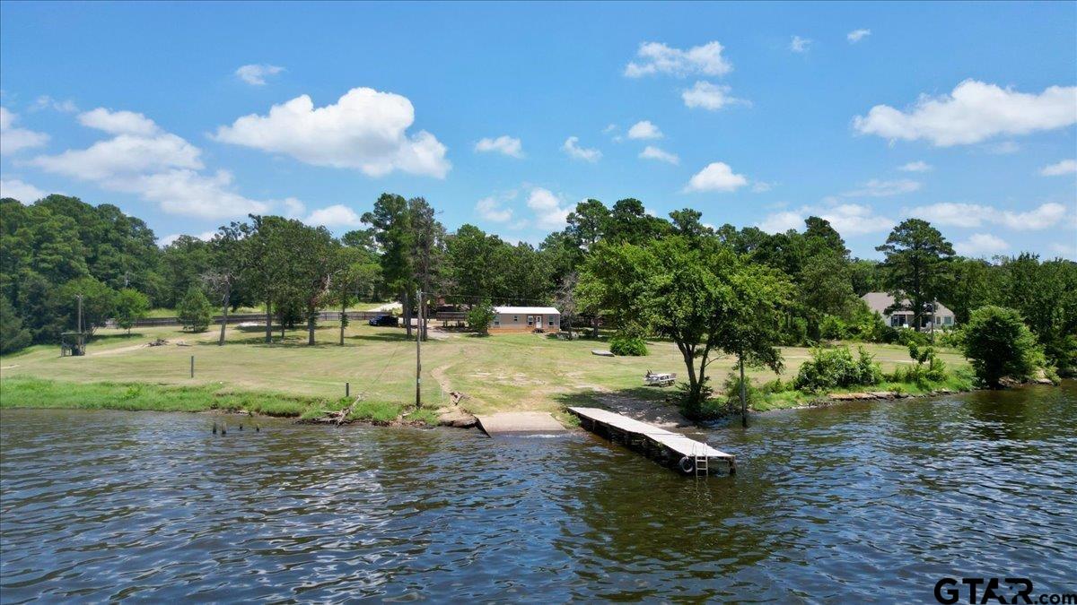 a view of a lake with a yard