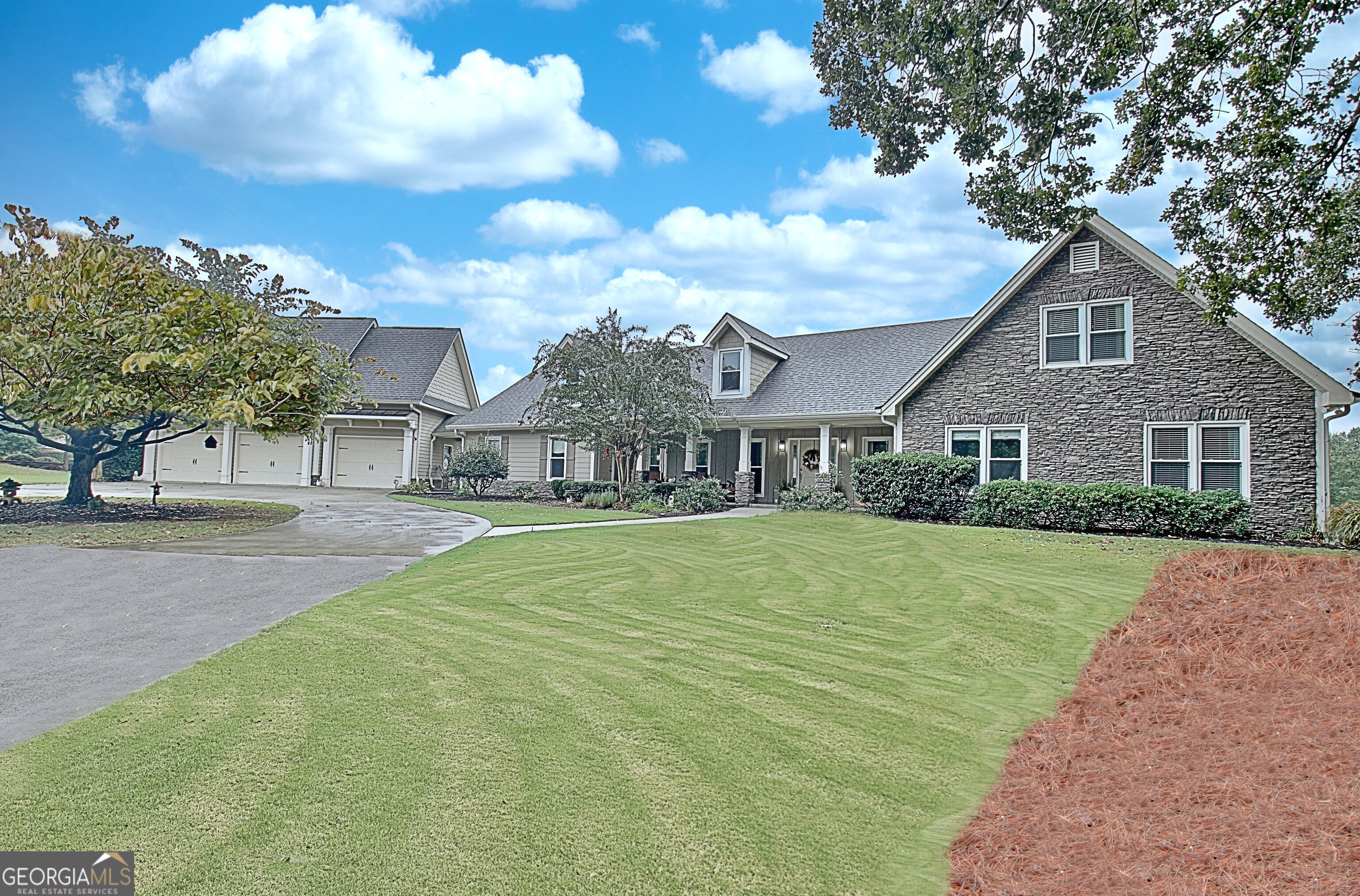 a front view of house with yard and green space