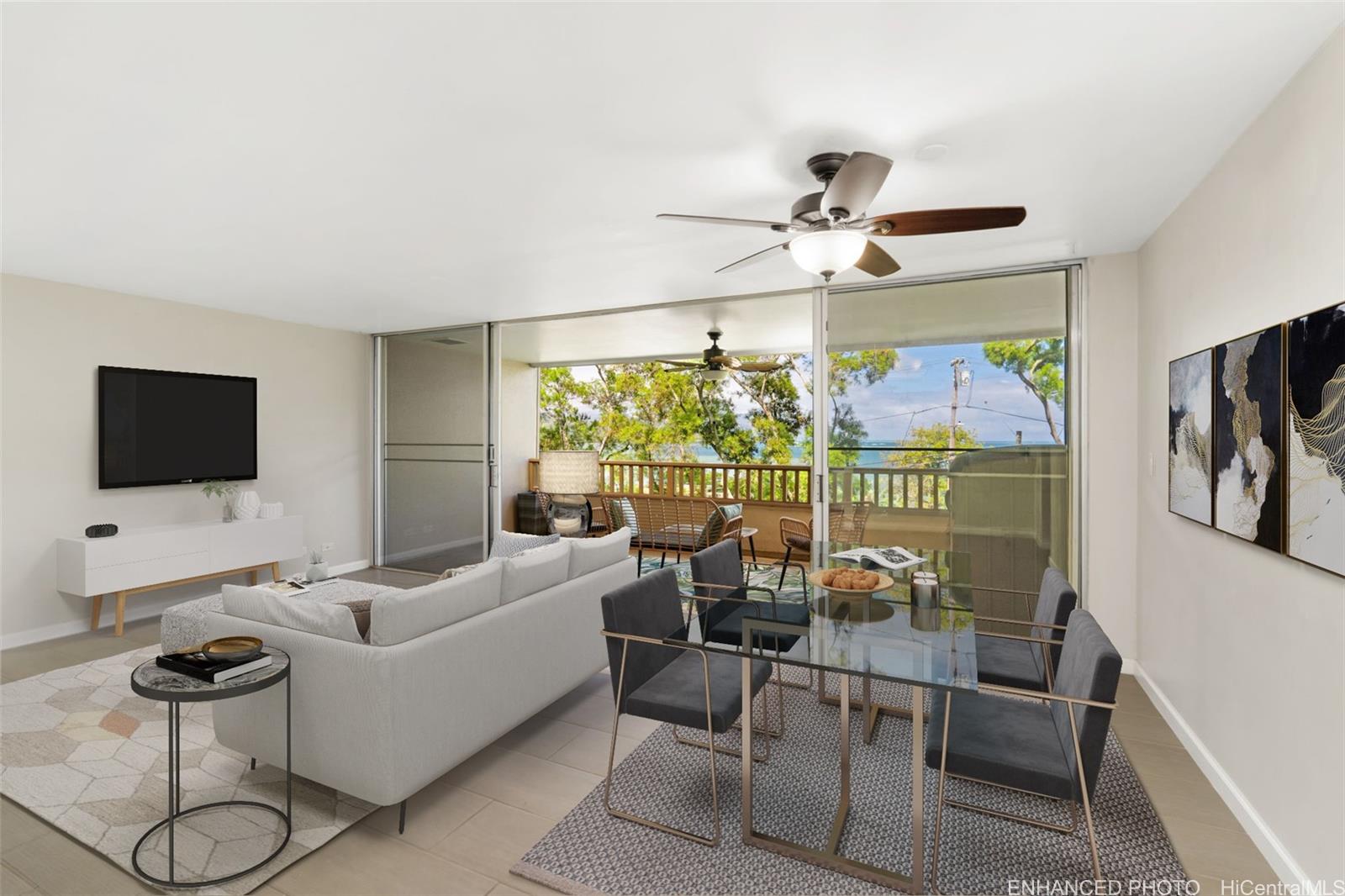 Spacious living room with open concept leading to the lanai. Enhanced