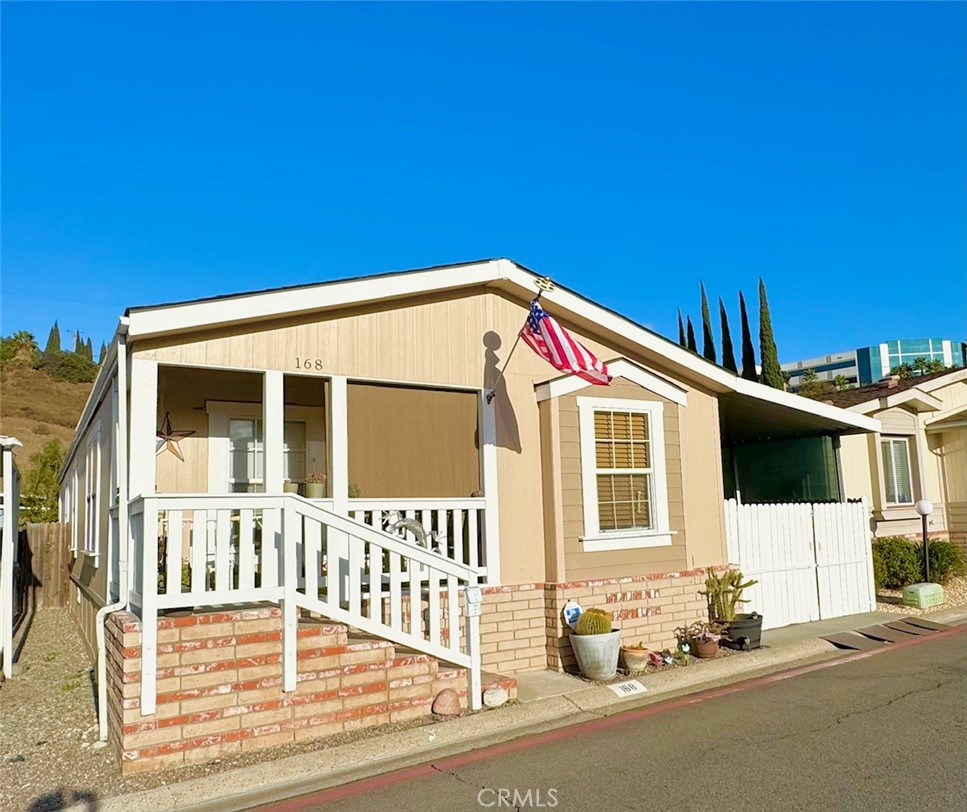 a front view of a house with a road