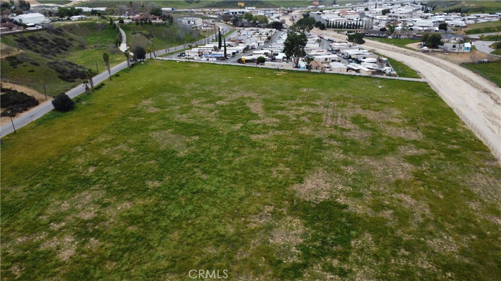 an aerial view of a houses with yard