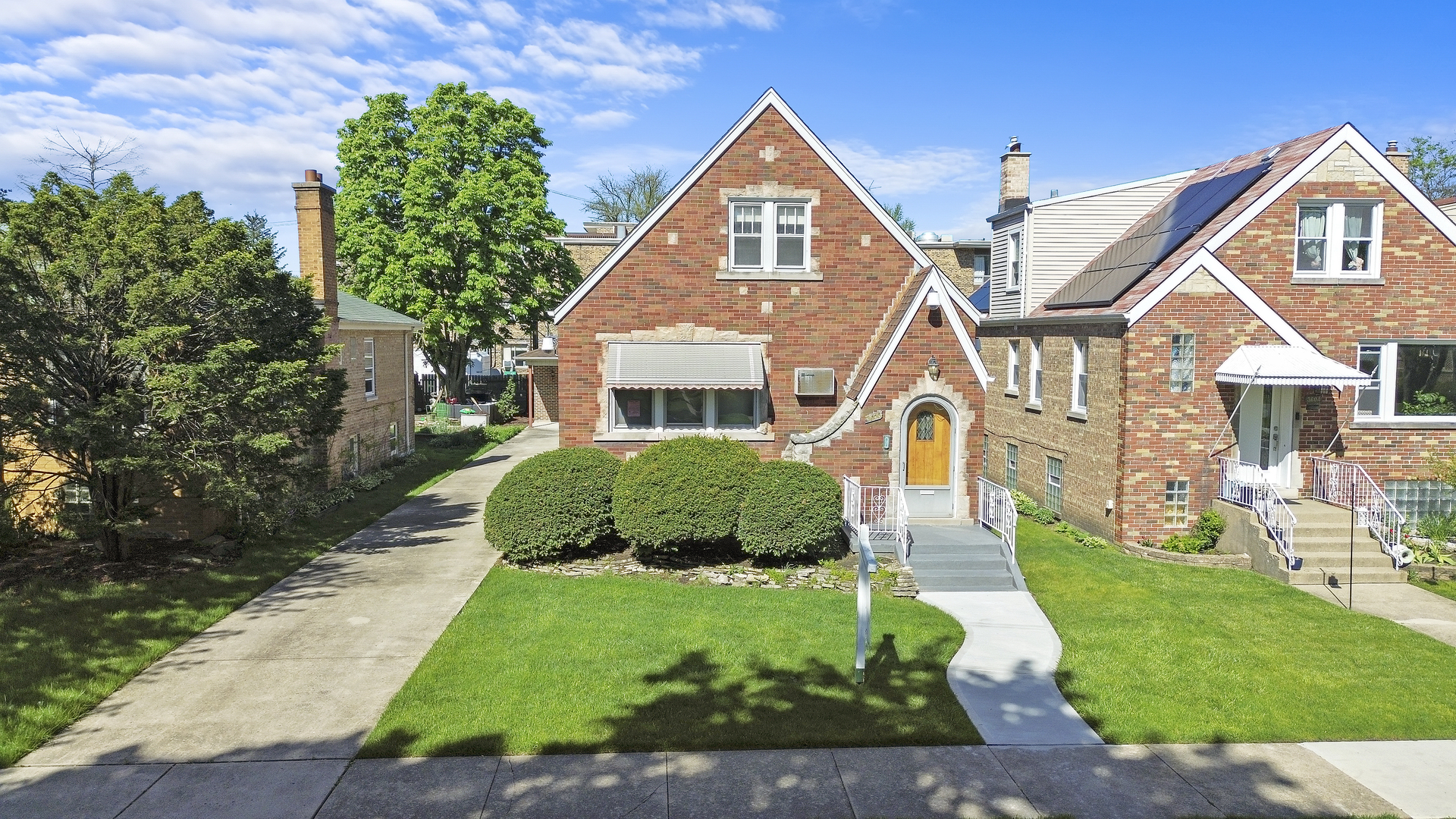 a front view of a house with a yard