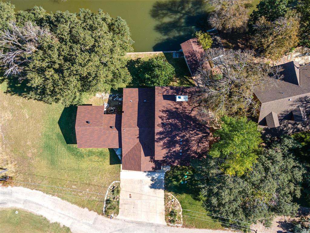 an aerial view of a house with a yard and plants