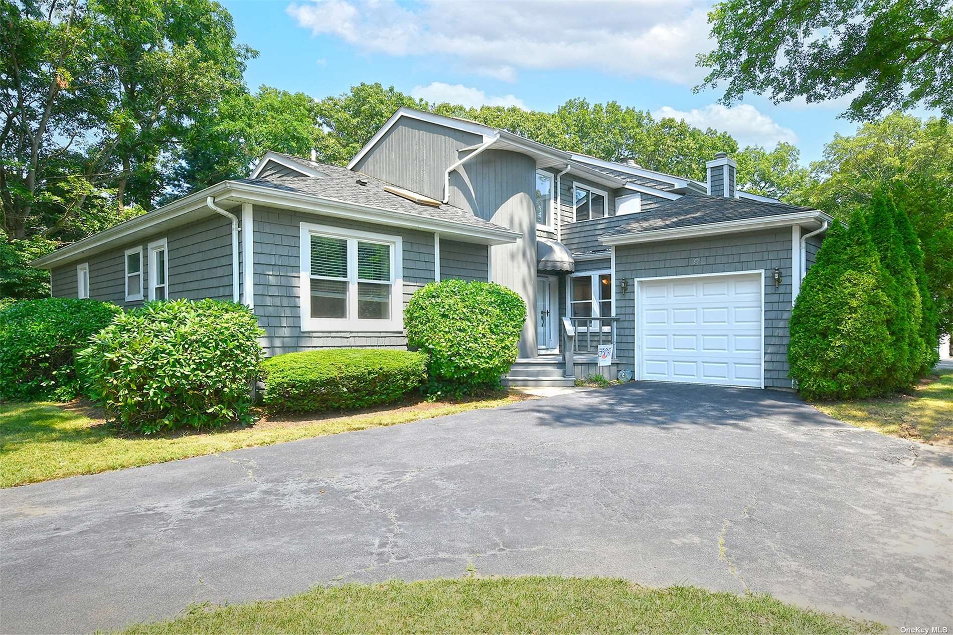 a view of a front of a house with a yard