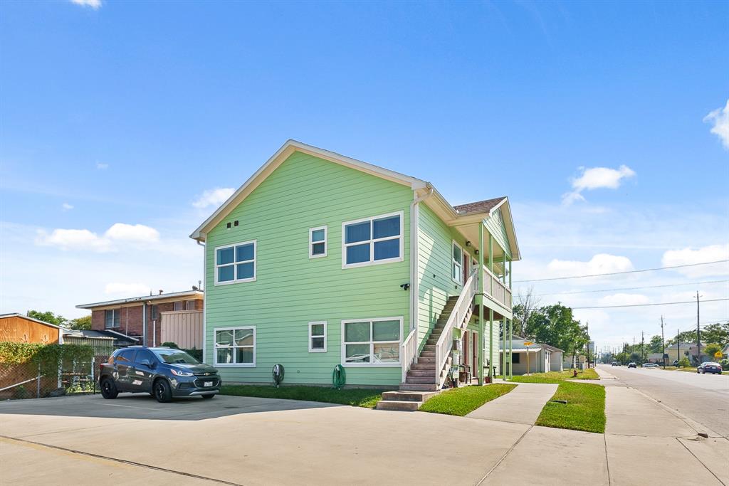 a view of a parked cars in front of a house