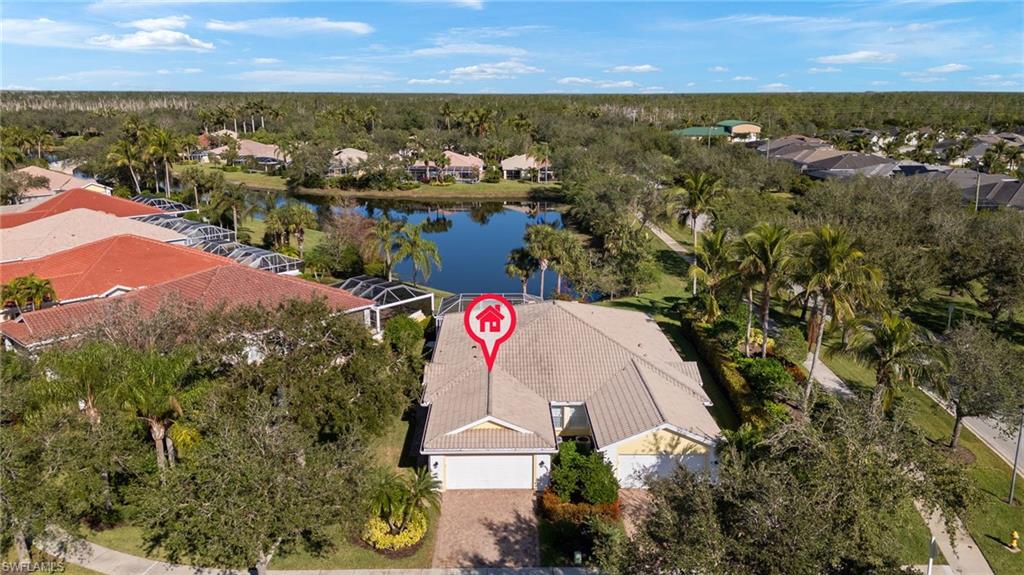 an aerial view of residential building and lake